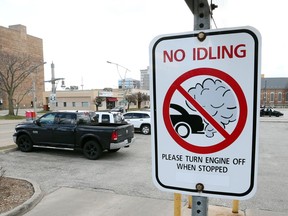 A sign warning motorists not to idle their car is displayed at Windsor City Hall in downtown Windsor on March 16, 2016.