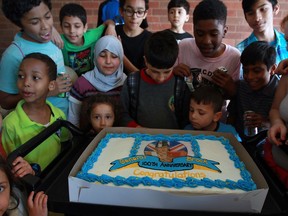 General Brock Public School students gather around a large birthday cake as the Sandwich community celebrated the 100th birthday of the naming of the popular west side school May 6, 2016.