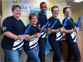 Batons in hand, relay team of Kelly O'Rourke, left; Cindy Melanson, Thorald Findlay, Judy Lund and Theresa Leslie prepare for the Relay for Life rally at Cancer Society May 12, 2016. The Relay for Life event takes place June 4.