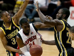 London Lightning Marcus Capers, left, and Stephen Maxwell defend against Windsor Express Chris Commons in NBL Canada playoff action from WFCU Centre on May 19, 2016.