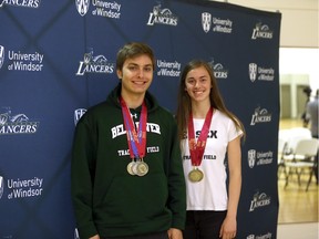 Fletcher Smith from Belle River District high school and Lucia McElwain, from Essex District high school talk about how the OFSAA Track and Field championships will be held in Windsor, Ontario. The two are high level track athletes and both have won numbers OFSAA medals. (JASON KRYK/WINDSOR STAR)