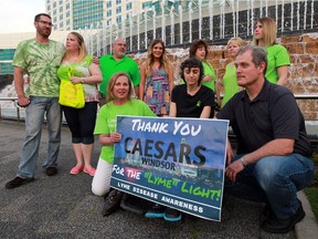 Cheryl Abbate, bottom left, joins Francesca and Joe Ventimiglia during a Lyme disease awareness event by members of Sun County Lyme Awareness Support Group in front of Caesars Windsor Thursday May 26, 2016.