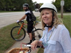 Lori Newton and Oliver Swainson, from Bike Friendly Windsor Essex, ride their bikes near Cabana Road West and Granada Avenue in Windsor, Ont. on Sept. 28, 2015.