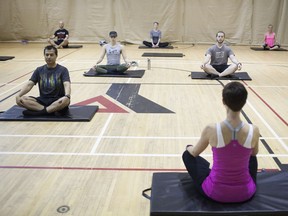 Carol Johnson, front, right, conducts a class during a tryout for a fitness instructor position at the YMCA, on Saturday, May 7, 2016.