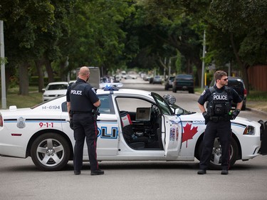 Windsor police close down the 900 and 1000 block of Monmouth Rd. after a shooting outside the Tim Hortons at Wyandotte St. East and Walker Rd. after a shooting, Wednesday, June 22, 2016. The assailant is still at large. (DAX MELMER/The Windsor Star)