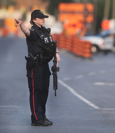 A Windsor police officer is shown on Wyandotte St. E. near Raymo Rd. on Wednesday, June 1, 2016 in Windsor, ON. Police set up a multi-block perimeter surrounding a residence on Pillette Rd. where a gunman was eventually arrested without incident. (DAN JANISSE/The Windsor Star)
