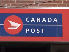 A Canada Post sign is seen on May 31, 2016 in Montreal.