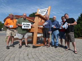 Ken Lewenza Jr., Rob McGuffin, Rob Andrew, Peter Boyle, Don Arkell, and Tom Carrothers take part in an Ontario Health Coalition information gathering in Amherstburg, Ontario on June 20, 2016. Amherstburg was the 65th stop of the Rocking Chair Tour that displays a giant rocking chair, calling for better care in long term care homes.