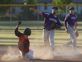The Tecumseh Thunder Seniors Matt Sykes throws over the Windsor Selects Juniors Jacob Radtenovich to complete the double play at Lacasse Park in Tecumseh on Wednesday, June 8, 2016.