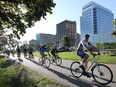 A group of cyclists participate in a bike to work day on Friday, June 3, 2016 along the downtown riverfront. The group biked from Memorial Park in South Walkerville to the CBC offices on Riverside Drive West.