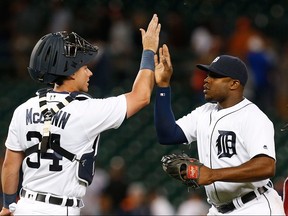 Detroit Tigers catcher James McCann (34) congratulates Justin Upton after beating the Toronto Blue Jays 11-0 in a baseball game Monday, June 6, 2016 in Detroit.