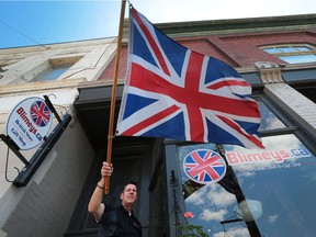 Carl Hulme, owner of Blimey's in Harrow reacts to the Brexit vote on Friday, June 24, 2016.