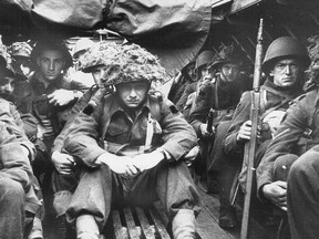 Canadian troops sit stoically in assault craft mere minutes before landing on Juno Beach the morning of D-Day, June 6, 1944.