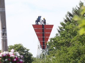 Workers from the Canadian Coast Guard complete regular upgrades on a navigational aid along the Detroit River in Amherstburg, Ont. on June 20, 2016.
