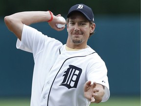 Detroit Red Wings defenceman Danny DeKeyser throws out a ceremonial pitch before the Detroit Tigers-Seattle Mariners baseball game in Detroit on June 22, 2016.