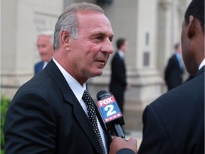 Former Canadiens star Guy Lafleur speaks to the media at The Cathedral of the Most Blessed Sacrament on Woodward Avenue in Detroit for the funeral of Gordie Howe, Wednesday June 15, 2016.