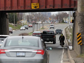 A cyclist braves the underpass on Dougall Avenue in Windsor on Monday, March 28, 2016.