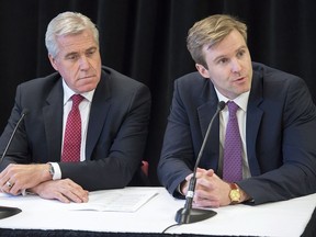Newfoundland and Labrador Premier Dwight Ball, left, looks on as New Brunswick Premier Brian Gallant fields a question as they attend a news conference at the end of a meeting of the Council of Atlantic Premiers at the Annapolis West Education Centre in Annapolis Royal, N.S. on Monday, May 16, 2016.