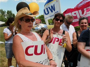 Barb Alexander, left, marked her 40th anniversary with the Essex County Library on the picket line Monday as 14 branches were closed because of a labour dispute.