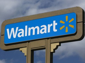 FILE - In this  May 28, 2013, file photo, an outdoors sign for Walmart is seen in Duarte, Calif.