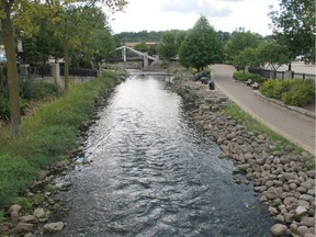 In this Sept. 12, 2013 file photo, the Fox River flows through downtown Waukesha, Wis. Representatives of the eight states in the Great Lakes region approved a Wisconsin city's request to tap Lake Michigan as its drinking water source on June 21, 2016 in Chicago.