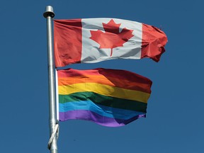 A Pride flag flies beneath a Canadian flag at the Kingsville District High School on Monday, June 6, 2016 after being raised during a ceremony.