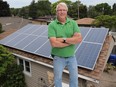 Michael Schneider, shown at his Windsor home on June 15, 2016, has several solar systems and drives an plug-in electric car.
