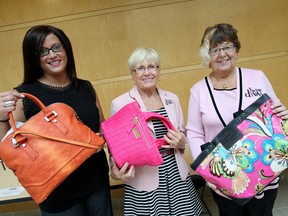 Do Good Divas Lindsay Lovecky, Vicki Granger and Gale Simko-Hatfield display purses which will be auctioned off at the annual "Diva Delighs: A Girls Night Out inHandbag Heaven" event which will be held on Oct. 27, 2016 at the Caboto Club in Windsor, Ont. The Do Good Divas held a campaign kick-off event at Windsor Regional Hospital's Metropolitan campus on Wednesday, June 15, 2016 seeking handbag donations for the event and pledging $30,000 to mental health programs at Windsor Regional Hospital.
