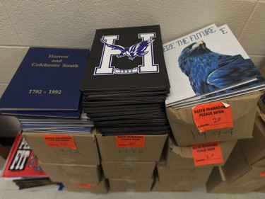 Old Harrow District High School yearbooks sit in boxes, Thursday, June 16, 2016.  The school is to be closed for good after this school year.