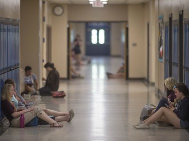 Students hang out in the hallway at Harrow District High School, Thursday, June 16, 2016.  The school is to be closed for good after this school year.