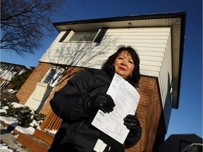 WINDSOR, ONT.:  DECEMBER 14, 2010. -- Petrona Parungo is photographed in front of her Little River Acres home in Windsor on Tuesday, December 14, 2010. Energy bills can be as high as $600 a month in the small homes which rely on electricity for heat. The City of Windsor and Enwin kicked off a study to try and lower energy costs for Little River Acres residents         (TYLER BROWNBRIDGE / The Windsor Star)