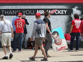 Fans sign a banner outside of the Joe Louis Arena in Detroit, Mich. on Tuesday, June 14, 2016 during a public visitation for Gordie Howe who passed away last week.