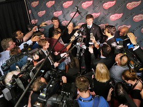 Wayne Gretzky speaks to a mob of reporters at the Joe Louis Arena in Detroit, Mich. on Tuesday, June 14, 2016. A public visitation was held for Gordie Howe who passed away last week.