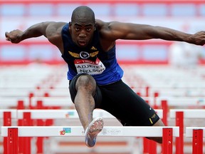 Jamie Adjetey-Nelson competes in the 110-meter hurdles during the decathlon event at the Canadian Track and Field Championships in Calgary, Alta., Thursday, June 28, 2012.