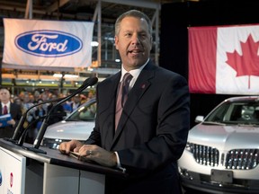 In this photo taken on Sept. 19, 2013, Ford President of the Americas Joe Hinrichs announces a $700-million investment at the Oakville Assembly Plant in Oakville, Ont.