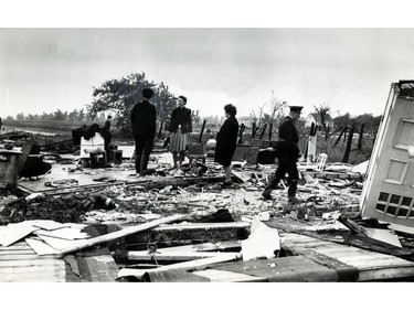 June 19, 1946: Police Chief Harris Bickford of Sandwich East Township, right, walks away from the occupants of one of the homes destroyed in the Clemenceau Road area of the township where six dwellings were completely levelled by a tornado on June 17, 1946. Speaking to a resident on the left is Const. Wilfred Langlois.