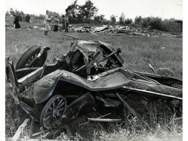 June 19, 1946: This photo shows what's left of a new car that was lifted 50 feet in the air, carried across Seven Mile Road and dropped in a ditch by a tornado that ripped through the Windsor area on June 17, 1946.