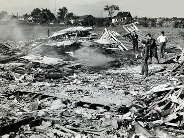 June 20, 1946: G.P Graham of Third Concession, with the help of three neighbours, clears away the debris after his house was levelled by a tornado on June 17, 1946.