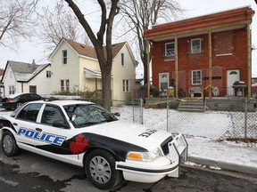 A Windsor police cruiser sits in front of a fourplex at 818 Langlois Ave. in Windsor, Ont. A man was shot at one of the lower units Mon. Dec. 9, 2013, at approximately 9:30 p.m.