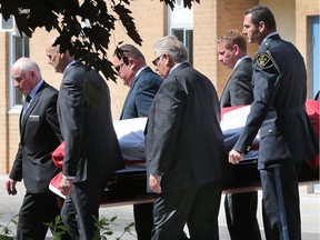Pallbearers carry the casket during a funeral service for Tecumseh town councillor Mike Rohrer on Thursday, June 2, 2016, at the Good Shepherd Parish in Tecumseh.