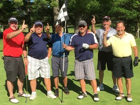 John Kaschak, centre right, celebrates his hole-in-one with Merv Herd, left, Dan Pickford, Gord Chan, Rick Dominato and Tim Eansor. Kaschak used an eight-iron to ace the 123-yard sixth hole on the Reflections course at the Garland Golf Resort in Lewiston, Mich. The witnesses were Herd and Dan and Dave Pickford.