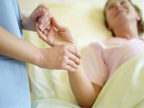 Nurse checking patient's pulse on wrist, close-up. Photo by Getty Images.