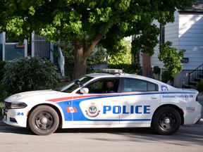 A Peterborough police officer and cruiser are pictured in this May 2016 file photo.