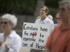 Mark Kahabka attends a rally held by Wings of Palliative Care protesting Bill C-14, the government's assisted dying bill, while at Charles Clark Square, Saturday, June 4, 2016.