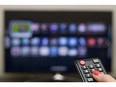 Remote control and Smart TV. Photo by Getty Images.