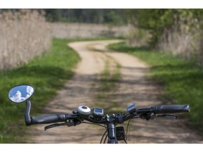 Riding bicycle on the road. Road safety. Photo by Getty Images.