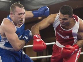Samir El-Mais lands a right to the head of Paul Rasmussen on his way to a unanimous decision in their 91kg bout at the Canadian Olympic Boxing trials, in Montreal, on Dec. 10, 2015.