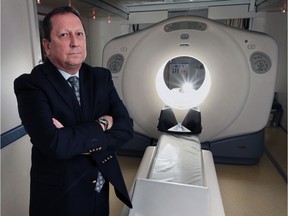 Dr. Kevin Tracey is shown with a PET scanner on June 22, 2016, at his Howard Avenue office in Windsor.