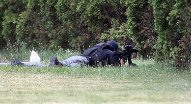 Windsor Police ESU members search for shooting suspect  the Motel 6 on Huron Church Road in Windsor, Ontario.   The suspect is wanted in an earlier shooting at the Tim Horton's in Walkerville.