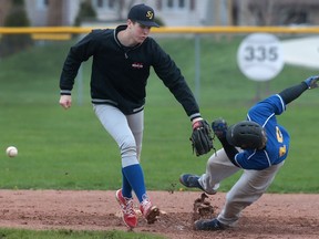 St. Anne's Shane Way slides safely into second base as St. Joesph's Marc Pineault attempts a tag during a game on April 26, 2016 in Tecumseh.